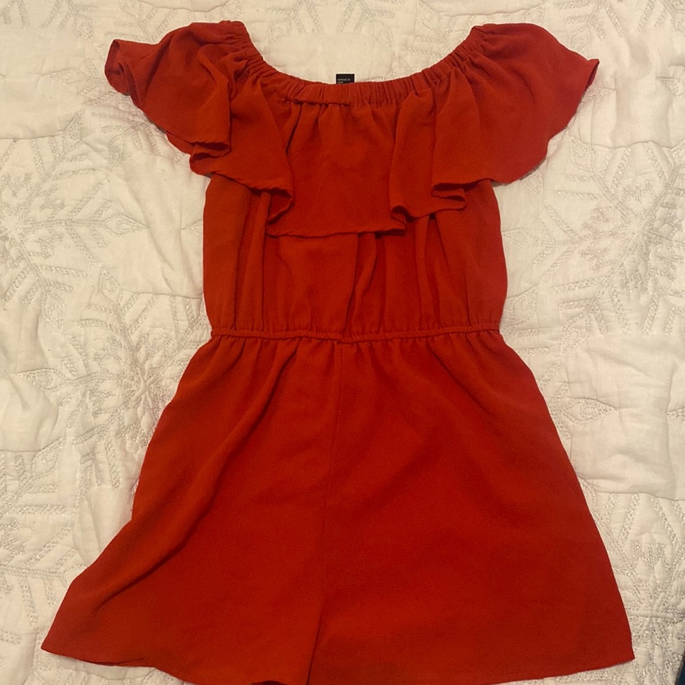 Red romper with ruffle